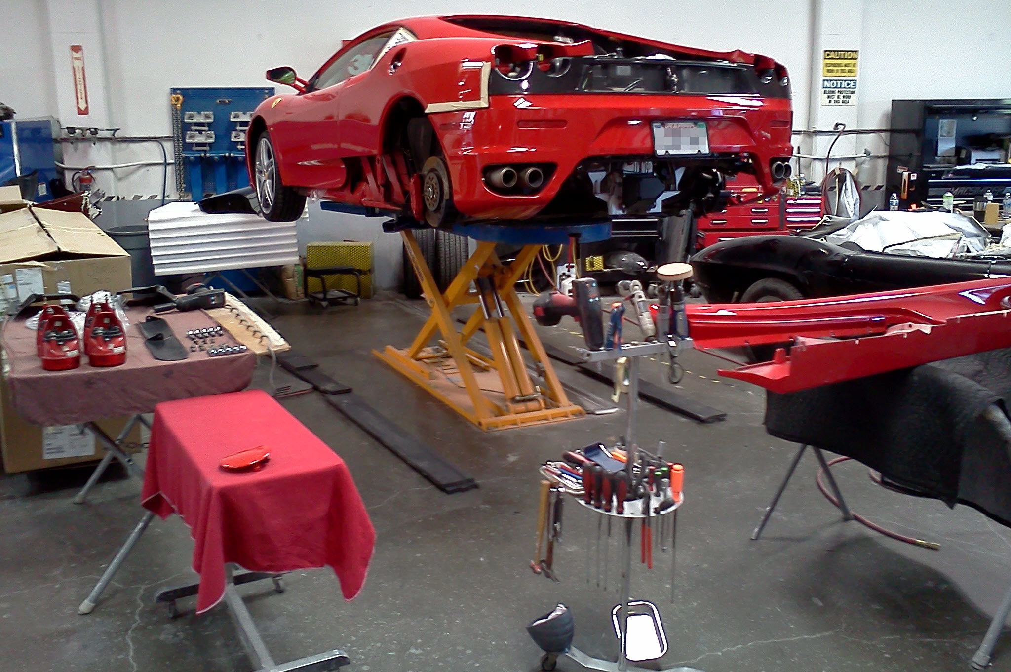 Ferrari F430 on repair lift